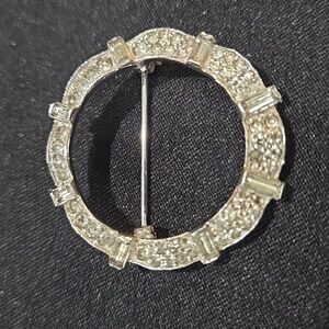Vintage JOMAZ Joseph Mazur circle brooch silver-tone finish and clear rhinestone